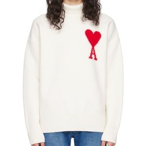 Felted knit RWS-certified virgin wool turtleneck.
• Rib knit collar, hem, and